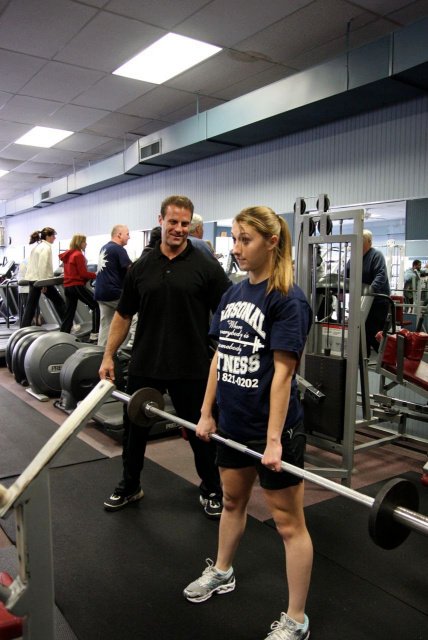 Gym owner training highschool athlete