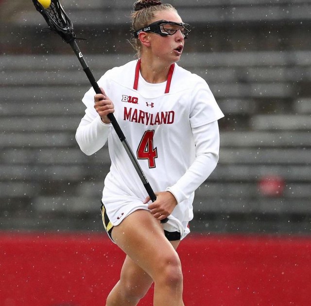College girl playing lacrosse